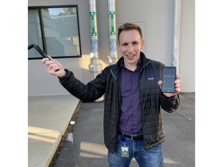 James Bell-Torres taking a field measurement with a sling hygrometer